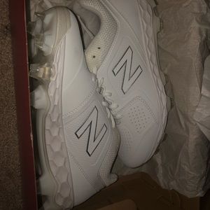 New Balance white softball cleats